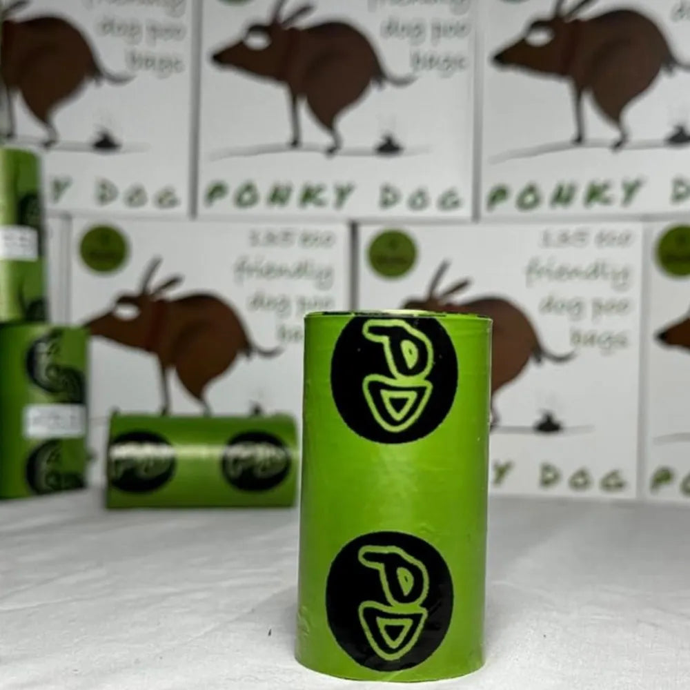 Eco-friendly extra strong dog poo bags by Ponky Dog green roll and packaging in background

